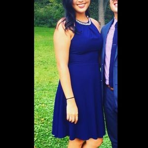 London Times • Navy blue dress with chain neck